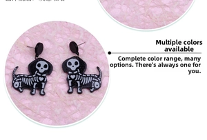 Detail of Halloween dachshund skeleton earrings with black acrylic and silver glitter finish