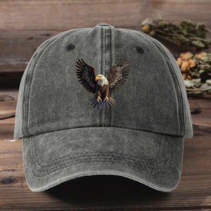 Detailed close-up of a vintage washed grey cotton baseball cap with eagle embroidery