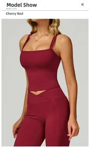 Detail view of cherry red double-strap yoga vest and V-waist leggings on model