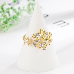 Elegant rotating windmill zircon ring in gold finish with sparkling crystal embellishments