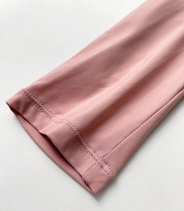 Detail shot of the pink push-up bra sleeves showing double-needle stitching and fabric texture