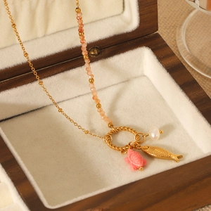 Golden sea turtle and fish pendant necklace with pearls in a wooden jewelry box
