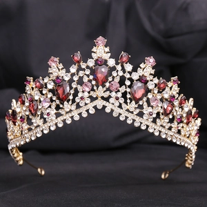 Detailed macro shot of bridal crown with sparkling red gemstones and pink crystals