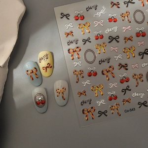 Mini leopard bow and cherry nail art stickers with chic 3D effect on display