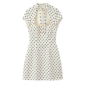 Polka dot short dress in cream with black dots, bow tie collar and back cutout detail