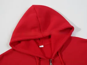 Detail of red hoodie neck with soft fleece lining, metal zipper, and white size L tag