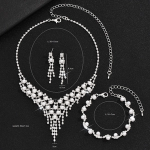 Detail view of pearl and rhinestone jewelry set with precise size and weight measurements