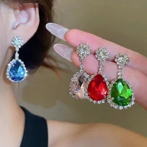 Elegant silver needle teardrop crystal earrings in sapphire, pink, red, and emerald colors