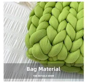 Macro detail of bright green chunky knit yarn texture on a handmade woven handbag