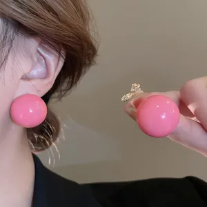 Minimalist glossy pink spherical stud earrings for women with a elegant polished finish