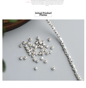 Close-up of geometric S925 sterling silver triangle beads for DIY jewelry making