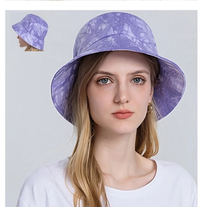 Detailed view of purple tie-dye cotton bucket hat with sun protection for outdoor activities