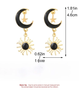 Detailed view of vintage celestial earrings showing alloy sun and moon dimensions