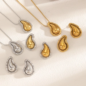 Minimalist lava teardrop necklace and earrings set in polished gold and silver steel finish