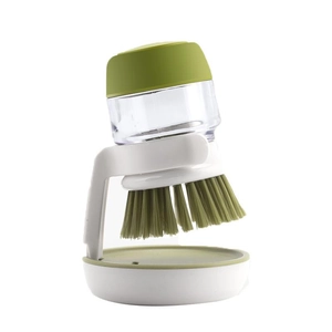 Green soap dispensing kitchen brush with a clear liquid reservoir and white round holder