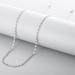 Polished stainless steel chain necklace draped on a white stand with bright metallic luster