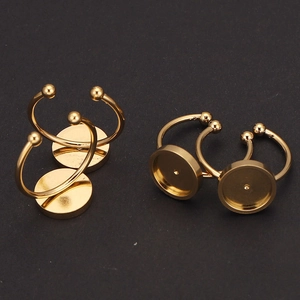 Detailed close-up of a golden stainless steel adjustable DIY ring base with round tray