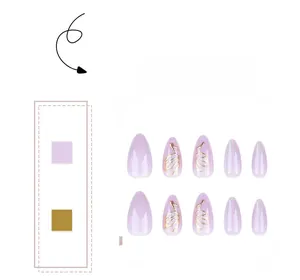 Macro detail of almond purple press-on nails with golden line accents and mirror finish
