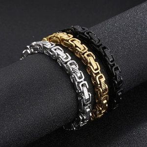 Macro view of Byzantine chain bracelets in silver, gold and black stainless steel