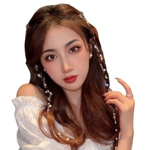 Elegant white pearl hair chain and crystal beads accessory worn by a model for styling