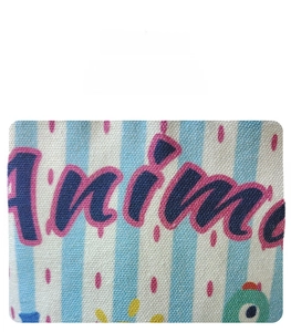 Close-up of canvas bucket bag featuring blue white stripes and Anime letter print