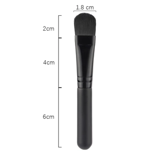Flat facial mask brush with soft black bristles and matte handle for skincare spa use