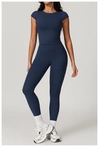 Front full view of deep blue seamless yoga set with slim fit top and high waist leggings