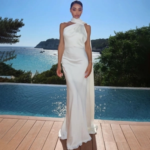 Elegant white satin backless maxi dress with ribbon scarf by the seaside pool