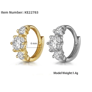 Close-up of 6mm S925 silver huggie earrings with three prong-set cubic zirconia stones