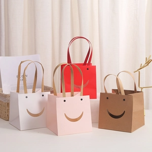 Square kraft paper gift bags with smiley face cutout in white pink brown and red colors