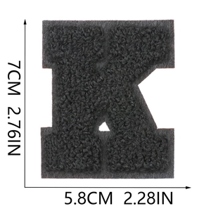 Detail showing letter K chenille patch with 7cm height dimensions and embroidery texture