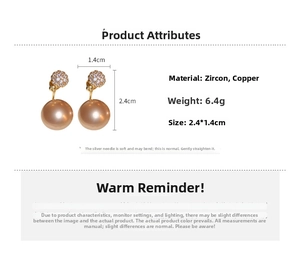Detail view of pearl earrings with cubic zirconia inlay and 2.4cm x 1.4cm dimensions