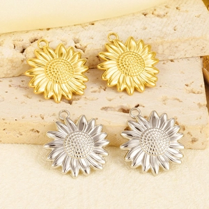 Macro shot of 304 stainless steel sun sunflower charms in gold and silver finish
