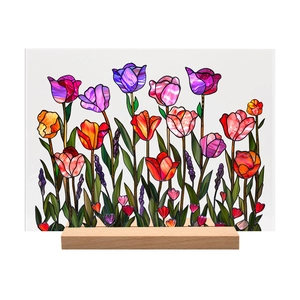 Detail of colorful acrylic tulip floral ornament with minimalist wooden base stand