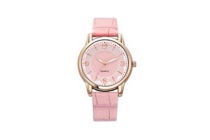 Detailed close-up of pink leather strap and rose gold quartz watch with numeric dial