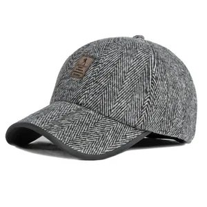 Winter herringbone wool baseball cap with warm ear flaps and brown leather label