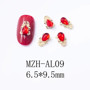 Detail of red water drop nail charms MZH-AL09 with gold hollow alloy base and red stone