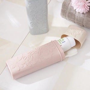 Portable floral embossed travel toothbrush holder case in pink and blue pastel colors