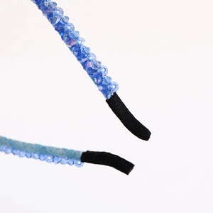 Blue double-row beaded headband featuring sparkling crystals and black comfort tip ends