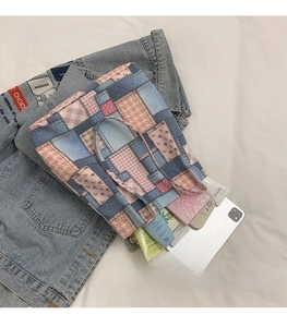 Detail showing spacious patchwork denim tote bag with plaid patterns and daily essentials