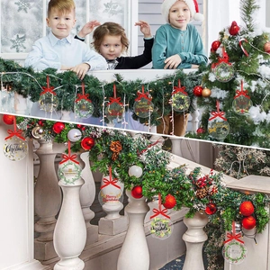 Staircase decorated with clear acrylic Christmas ornaments and red ribbons in a festive home