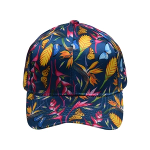 Detail of tropical floral print on dark blue baseball cap with butterfly pattern
