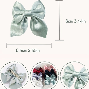 Handmade silk bow hair clip in mint green with dimensions and multi-color options