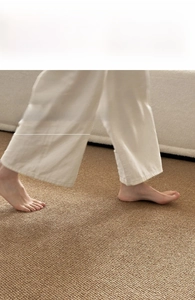 Close-up of woven textured rug with soft surface showing comfort for walking barefoot