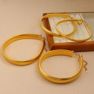 Detail of 18K gold-plated Tubogas snake chain necklace with lobster clasp and adjustable link
