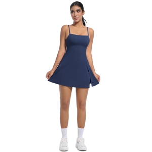 Detail view of navy blue athletic dress featuring slim straps and a stylish side slit design