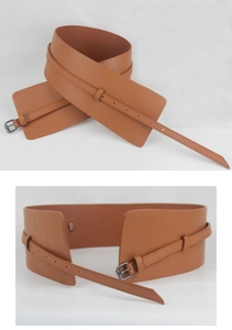 Detail of a brown wide leather waist belt featuring a double buckle design and metal hardware