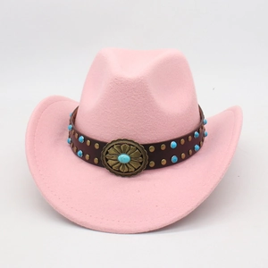 Pink western cowboy felt hat with turquoise accents and leather band on white background