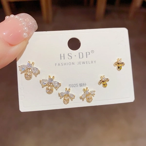 Three-piece gold zircon bee earring set with S925 silver needles shown on a jewelry card