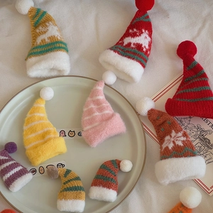 Miniature knitted Christmas hats in various colors for DIY doll crafts and holiday decor